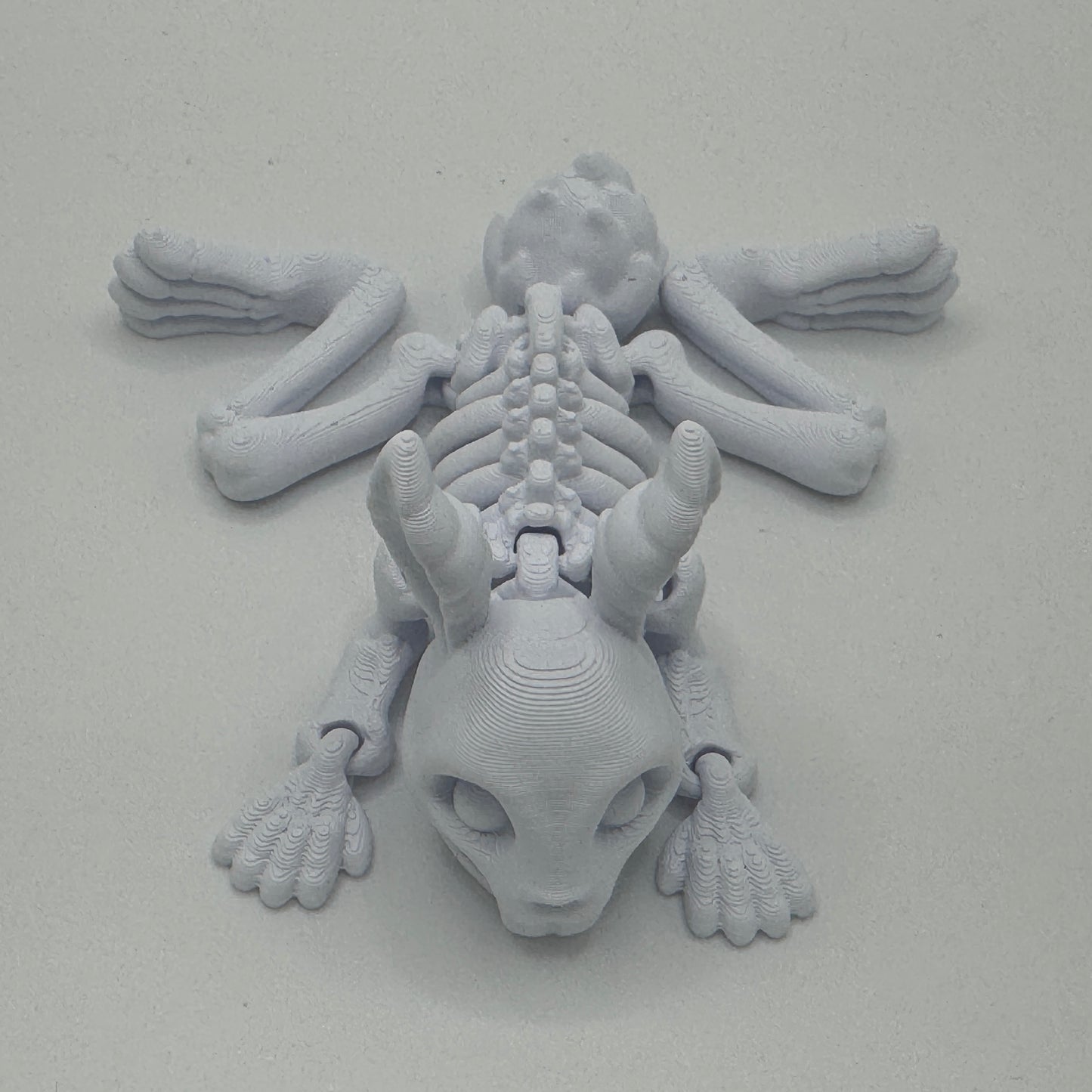 3D-printed bunny skeleton model on a plain background