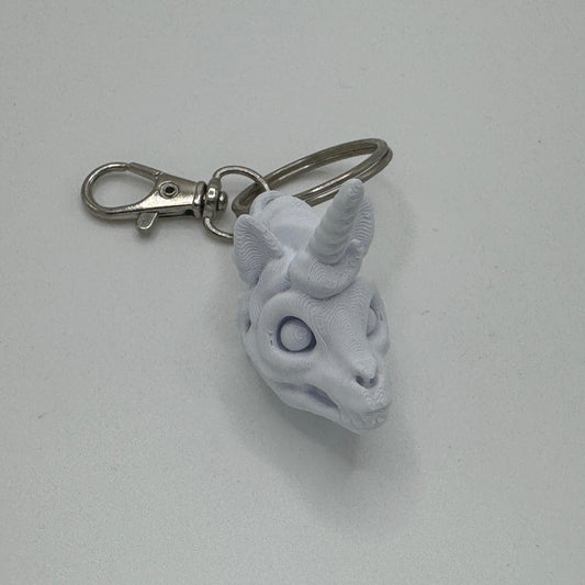 Keychain with a unicorn head design on a white background