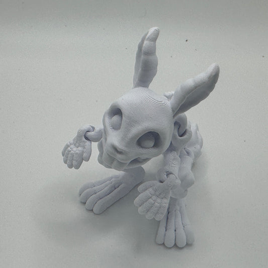 Gray 3D-printed bunny figurine on a white background