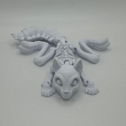 Gray 3D-printed creature on a light gray background